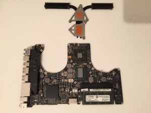 MacBook Pro logic board with reflowed graphics chip and thermal paste removed