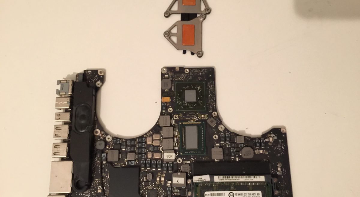 MacBook Pro logic board with reflowed graphics chip and thermal paste removed